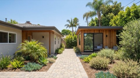 A small modern ADU guest house tucked behind a mid-century ranch home in a Studio City backyard