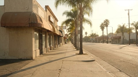 A quiet commercial strip near Toluca Lake's entertainment-industry district in late afternoon light.