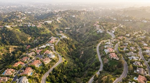 An aerial-style view of the Bel Air hillside showing distinct residential pockets separated by winding roads and canyons
