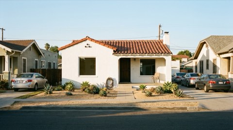 A tidy traditional single-family home in Beverlywood set on a quiet street in late afternoon light