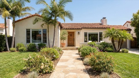 A traditional Beverlywood home exterior staged for viewing with a clean walkway in bright midday sun