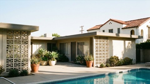 A mid-century modern condominium courtyard in Los Feliz beside a traditional single-family Spanish home