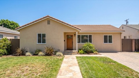 A modest charming starter ranch home in Studio City under bright midday sun