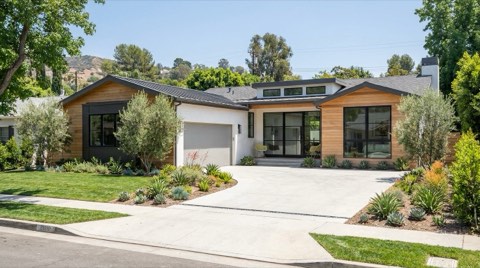 An upscale renovated single-family home exterior in Studio City under clear midday light