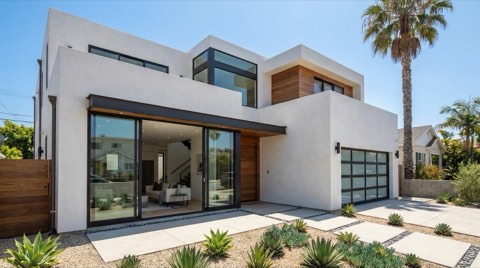 An upscale modern architectural home exterior in Venice under bright midday sun