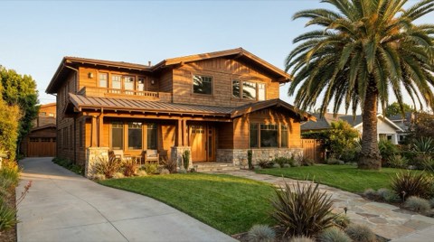 An upscale Santa Monica single-family home with manicured landscaping and warm golden-hour light, showing strong curb appeal for a home about to be listed
