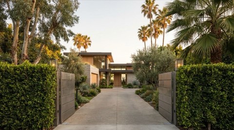 An exclusive gated modern estate home on a private tree-lined Venice driveway