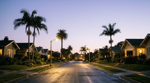 A calm, well-lit residential street in Venice at dusk