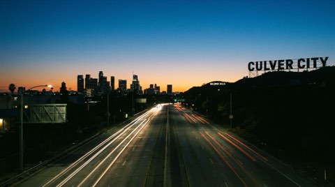 A road leading into Culver City at dusk, evoking the commute versus live-local choice.