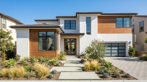 A modern home exterior with tidy manicured front landscaping and clean curb appeal under bright daylight.