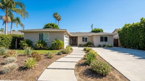 A well-kept single-family home exterior in Studio City with a clean walkway under bright daylight