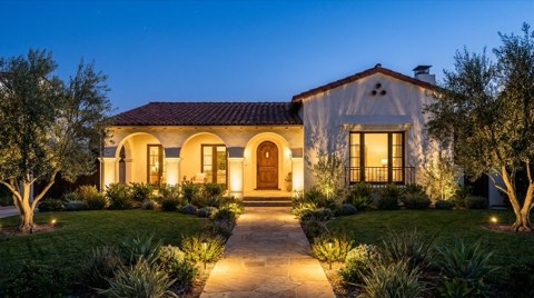 A professionally staged Los Feliz home exterior lit dramatically at twilight blue hour