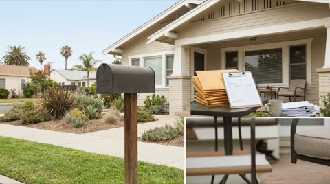 A tidy single-family home exterior with a curbside mailbox and clean landscaping in neutral bright daylight