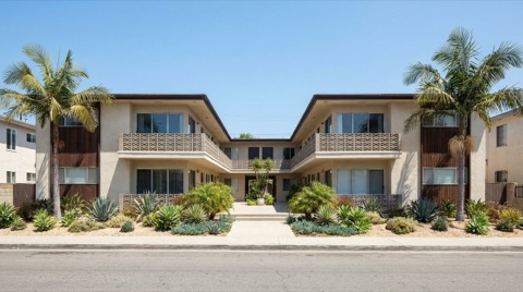 Older multi-unit apartment building on a residential Los Angeles street