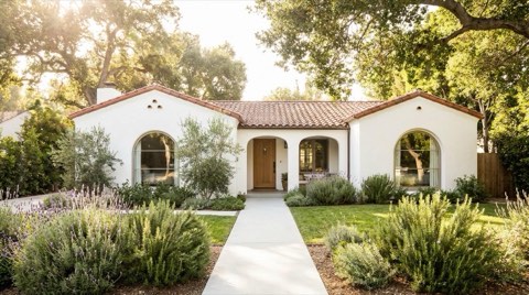A charming traditional home exterior freshly prepared for sale with tidy landscaping and a clean walkway.