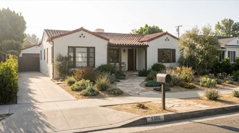 A single-family home exterior in Studio City with a curbside mailbox in soft morning light