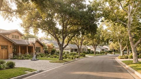 Valley Village residential street with a basketball hoop in a driveway