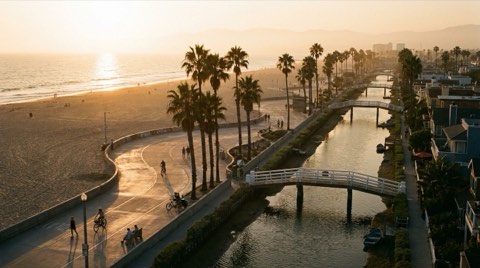 A golden-hour view combining the Venice boardwalk and canal district