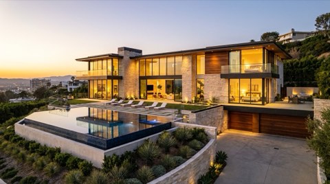 Upscale Los Angeles hillside home glowing at dusk