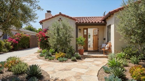 A welcoming home entrance and walkway in Studio City with neat landscaping at midday
